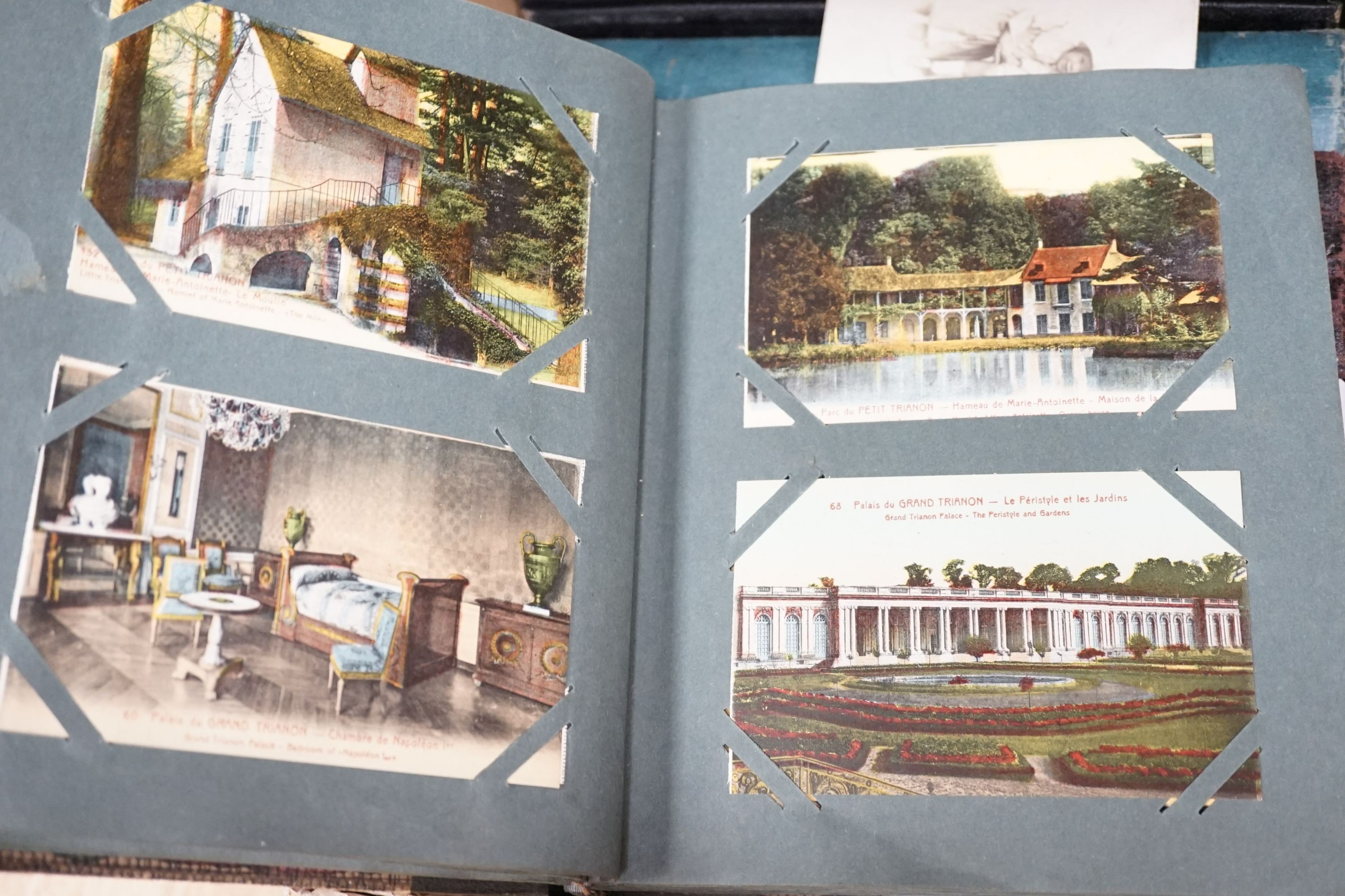 Thirteen early to mid 20th century postcard albums, mostly topographical of scenes of the UK and some of the Continent, including a few greeting cards. (Two boxes)
